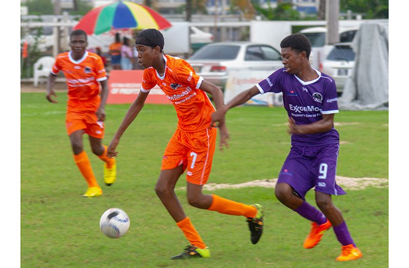 this Japheth Savory photo shows quarter final action I the ExxonMobil U14 tournament