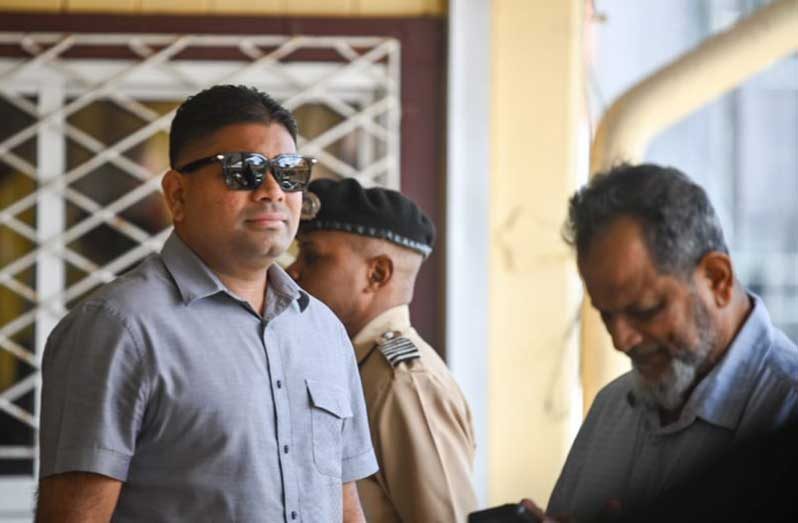 Nazar Mohamed and his son Azruddin during an appearance at the High Court in Demerara