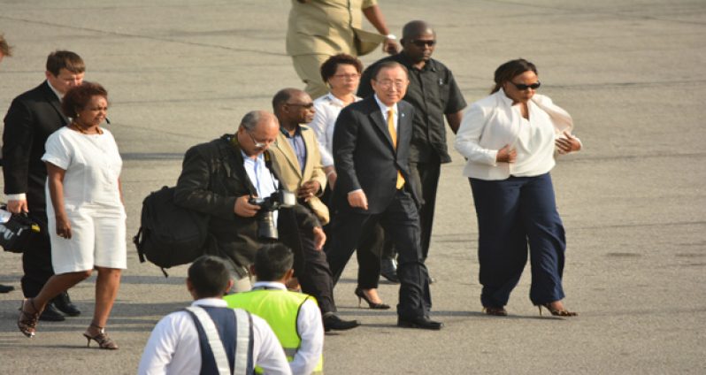 United Nations Secretary-General Ban Ki-moon being escorted to the VIP lounge at the Cheddi Jagan International Airport by Foreign
Affairs Minister, Carl Greenidge and other officials of the Guyana Government and the UN office here (Samuel Maughn photo)