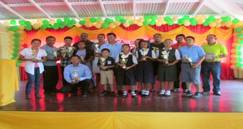 Awardees and education officials of the Moruca Sub-Region in Region 1 pose for a picture at the annual education awards ceremony