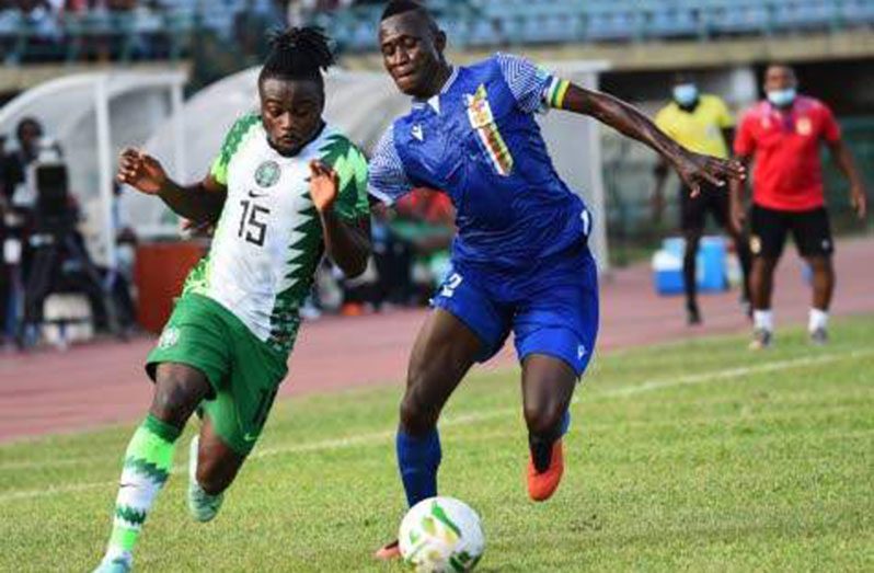 Central Africa Republic defender Saint-Cyr Ngam-Ngam (right) challenges Nigeria forward Moses Simon during the 2022 Qatar World Cup African qualifiers Group Three football match at Teslim Balogun Stadium in Surulere, Lagos State, on Thursday. (Photo: AFP)
