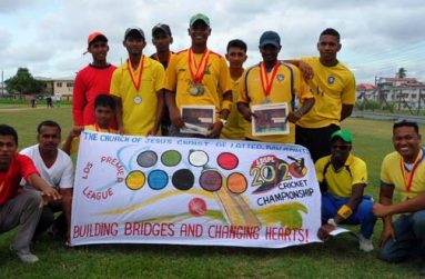 The victorious Mosiah Yellow lineup pose with their spoils and a broad smile, after defeating Queenstown Jama Masjid in the final of the LDSPL T20 tournament last Thursday at the MYO ground.