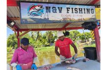 Natasha Chatterpaul and her son, Vickram Chatterpaul, at their fish stall