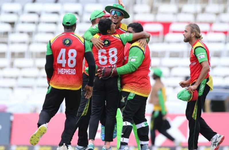 Gudakesh Motie (#68) is mobbed by teammates after his magnificent final over on Sunday (Photo: CPLT20).