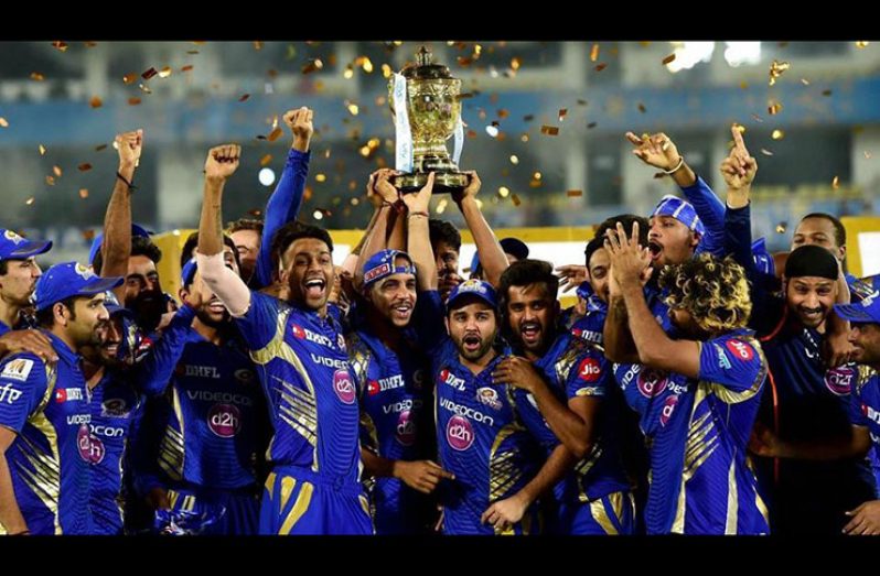 Mumbai Indians cricketers celebrate with the trophy after winning the IPL 2017 title. (PTI)