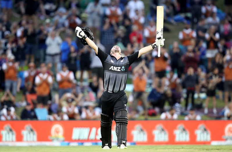 Munro soaks in his third T20I hundred, the only man to do so. (Getty Images)