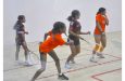 Tehani Munroe (2nd left) executes a powerful forehand shot in the Girls Doubles on Wednesday evening at the NRC