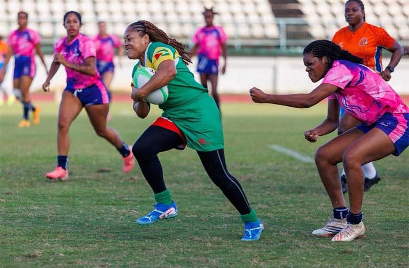 Guyana national female rugger Tricia Monroe on the go against Bermuda.