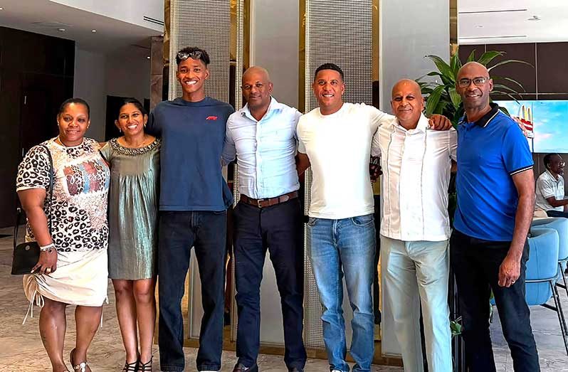 Raekwon Noel (third from left) with GOA President Godrey Munroe (fourth from left) and his team