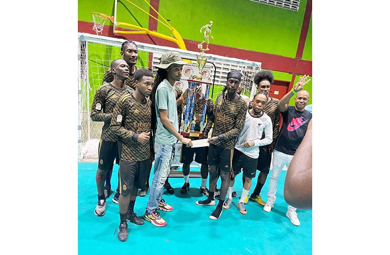Andrew Murray (centre) of Gold is Money receives the championship trophy.