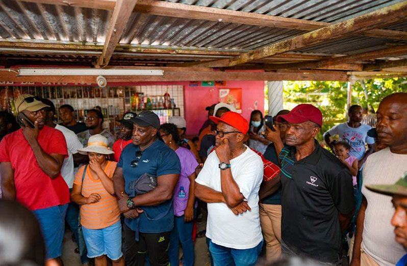 Some of the residents of Coverden listening to the VP and Minister Mustapha at Friday’s meeting in the village