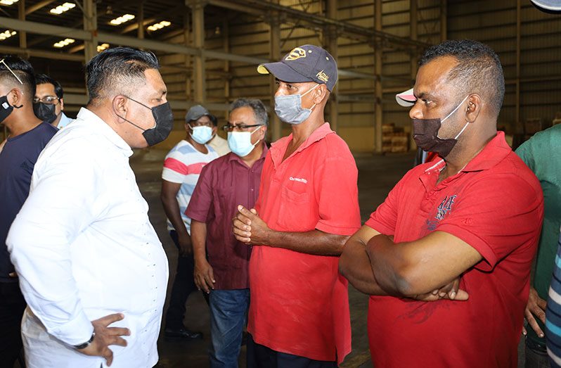 Minister Zulfikar Mustapha engages some of the workers at the Enmore packaging Facility (Ministry of Agriculture photo)