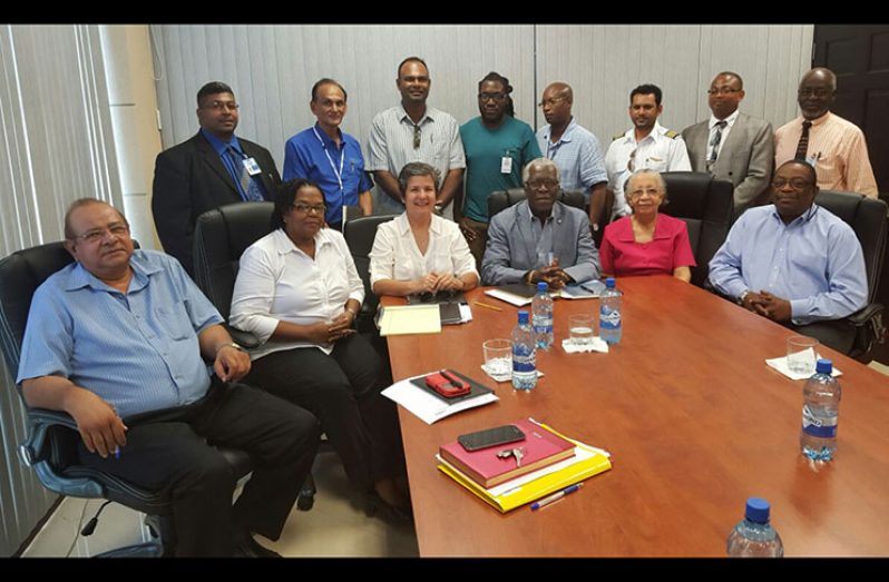 NATA President Annette Arjoon seated with Director General Egbert Field (centre) and others meeting stakeholders