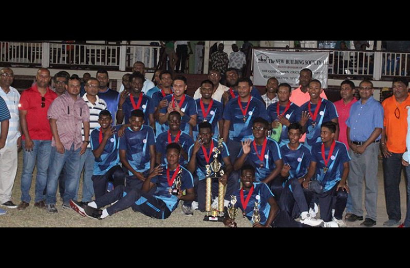 : Four-time champions GCC pose with officials and sponsors after the game.