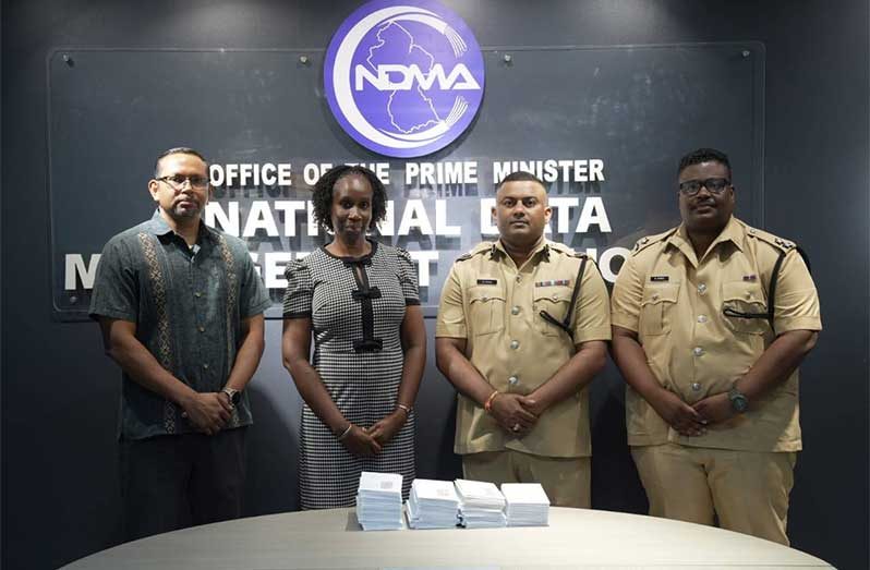Traffic Chief, Assistant Commissioner Mahendra Singh (second from right), flanked by NDMA and GPOC officials during the first batch of e-tickets that was generated, packaged, and delivered to the GPOC for registered posts