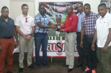 (L-R) Kenrick Noel, Stag Beer Brand Manager John Maikoo, Aubrey Major Jr, Sales and Operations Manager at Cell Smart Lenford Malcolm, Sean Abel, Stag Beer Representative, Shareef Major and Winston Fraser.