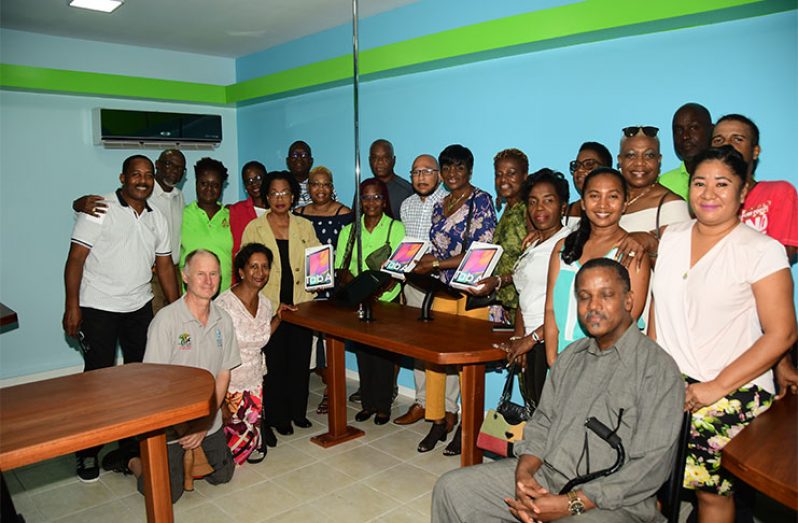 Part of the North Georgetown Secondary School Alumni at the handing over of tablets for the school’s E-library (Adrian Narine photo)