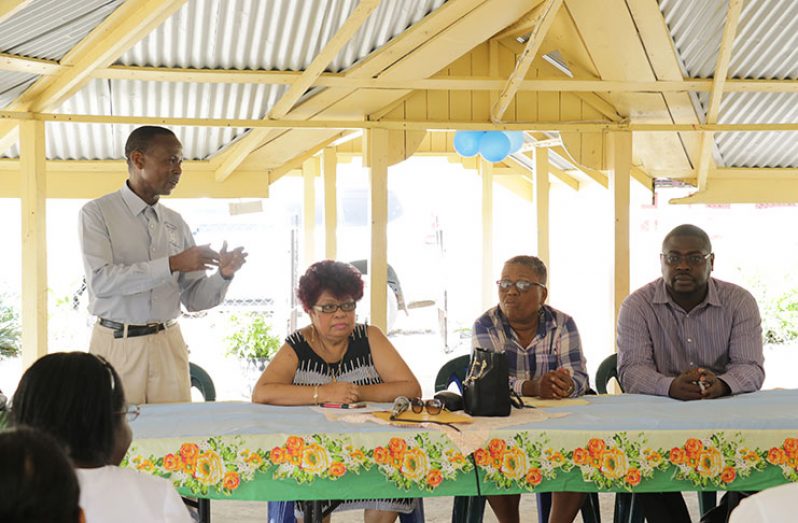 A staff of the NOC makes a point on Wednesday during a meeting with Minister of Social Protection Amna Ally and other officials (Ministry of Social Protection photo)
CAPTION: Minister of Social Protection, Amna Ally (seated left), Director CH&PA Ann Greene and Director of Social Services, Wentworth Tanner, listening to an official make a point (Ministry of Social Protection photo)