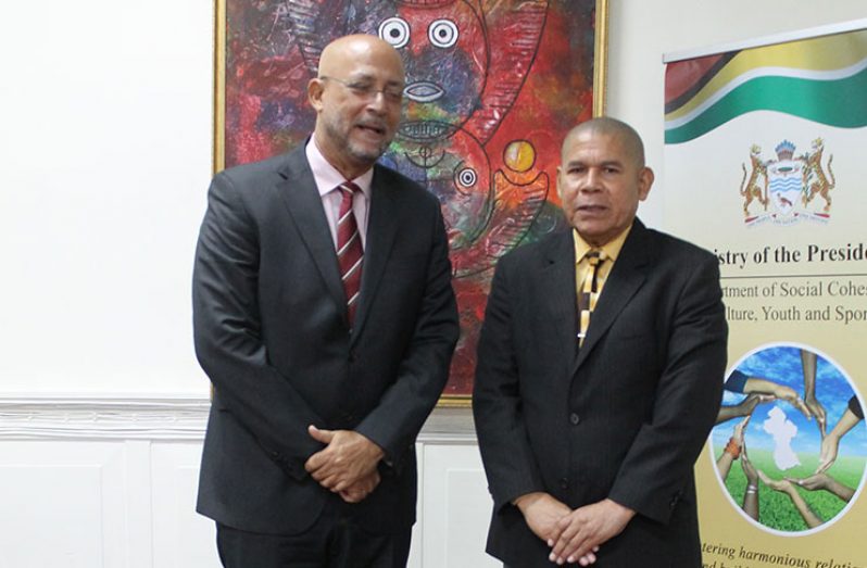 Minister of Social Cohesion with Responsibility for Culture, Youth and Sport, Dr George Norton poses with Cricket West Indies president Richard Skerritt.