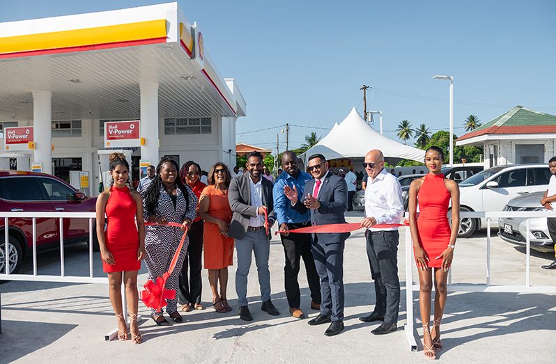 Minister of Natural Resources, Vickram Bharrat and other officials at the ceremonial ribbon cutting at the new Shell gas Station in Enmore ( Delano Williams photo)