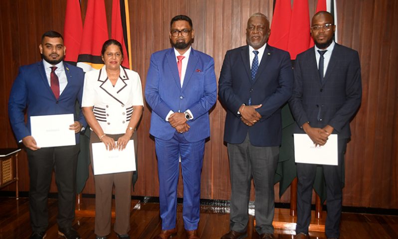 President, Dr. Irfaan Ali (centre) and Prime Minister Brigadier (ret’d) Mark Phillips (second right), along with some of the members of the NRF Investment Committee. From left are: Richard Rambarran, Chairperson Shaleeza Shaw and Michael Munroe (Adrian Narine photo)