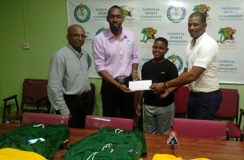 L-R Coach Linden Johnson, Christopher Jones, Kaysan Ninvalle and GTTA President Godfrey Munroe.