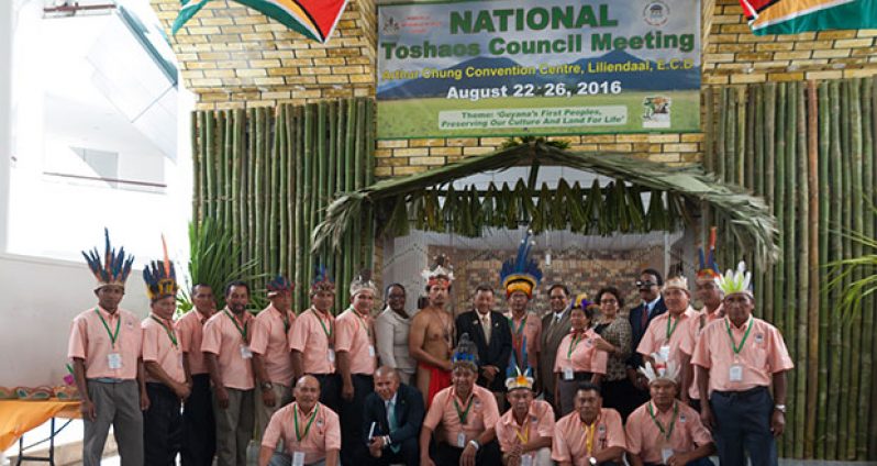 Several indigenous leaders pose with officials of the government prior to the opening of the NTC meeting on Monday.