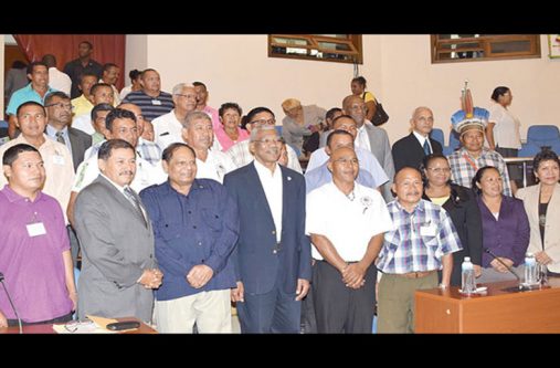 President David Granger, Prime Minister Moses Nagamootoo and Vice President and Minister of Indigenous People’s Affairs, Sydney Allicock, with elected officials of the National Toshaos Council and other members of the Cabinet. [File Photo]
