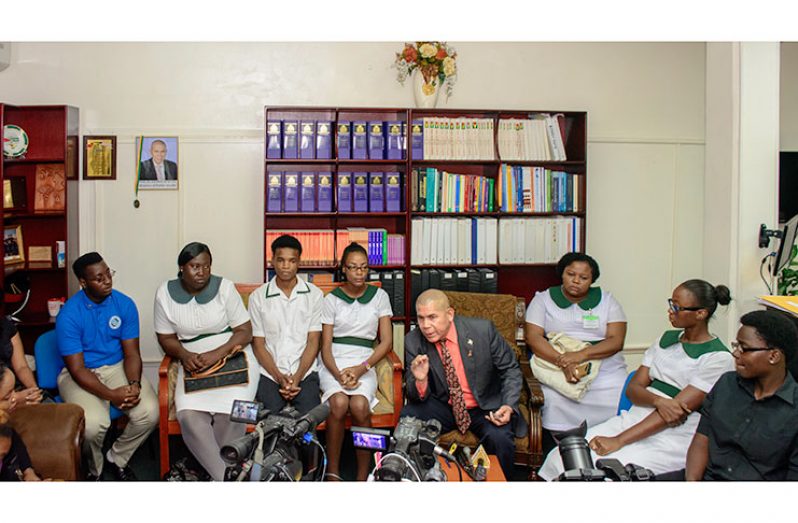 Public Health Minister Dr. George Norton sitting with some of the affected nursing students to discuss the decision taken by the Guyana Nursing Council on November 16, 2016