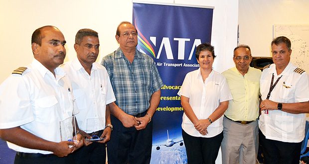 The awardees, from left: Gary Sahai, Bholanauth Baijnath and Ankar Doobay, with ASL’s Annette Arjoon-Martins, Edward Boyer of the PSC and owner of Roraima Airways Gerry Gouveia