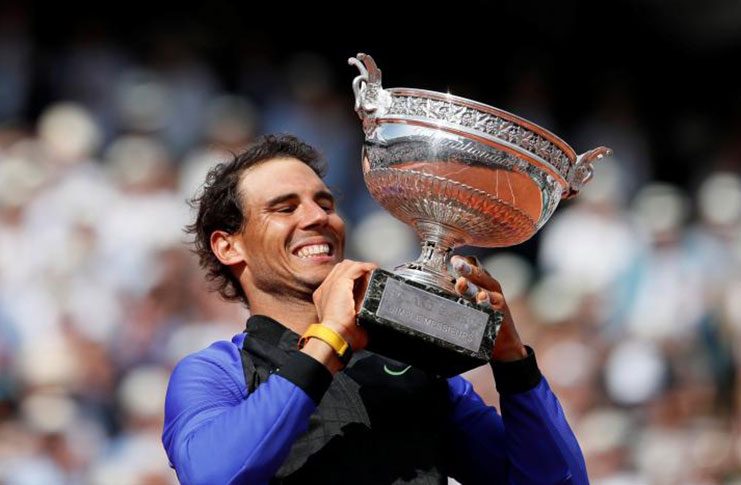 Spain's Rafael Nadal celebrates with the trophy after winning the final against Switzerland's Stan Wawrinka Reuters / Christian Hartmann