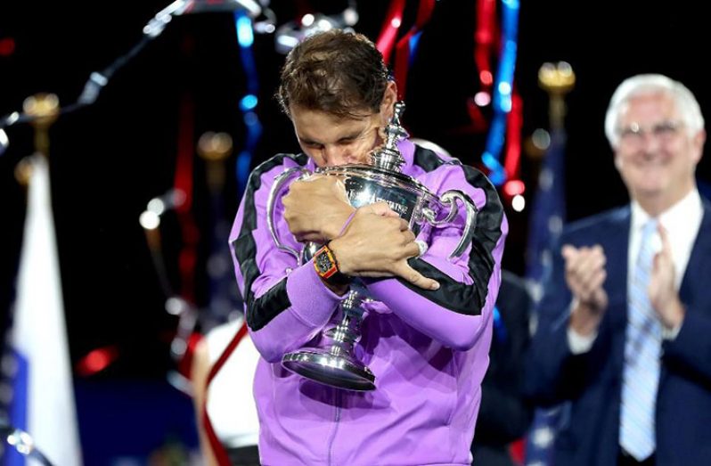 Rafael Nadal of Spain celebrates with the championship trophy during the trophy presentation ceremony after winning his Men's Singles final match against Daniil Medvedev of Russia on Sunday. (Photo by Matthew Stockman/Getty Images)