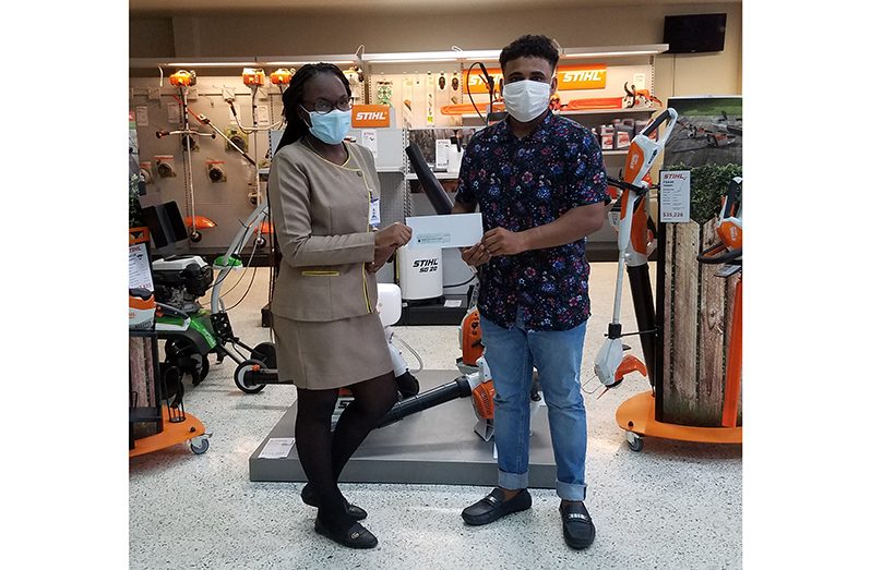 RHTYSC Assistant Secretary/CEO Simon Naidu receives sponsorship from Joshanna Marcus of Farfan & Mendes Ltd.