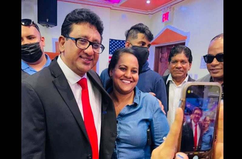Attorney-General and Minister of Legal Affairs, Anil Nandlall, S.C. with a member of the diaspora at the Town Hall event in New York city