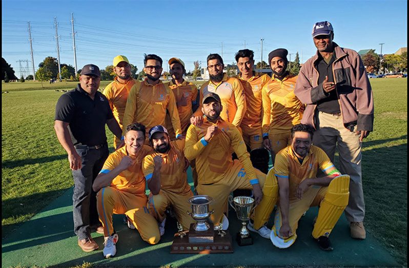 Last year’s Elite Division winners Naseeb Cricket Club pose with their trophies following their victory over Victoria Park. SCA Secretary Eon Gunraj is extreme left while Grounds Coordinator Calvin Alexander is extreme left