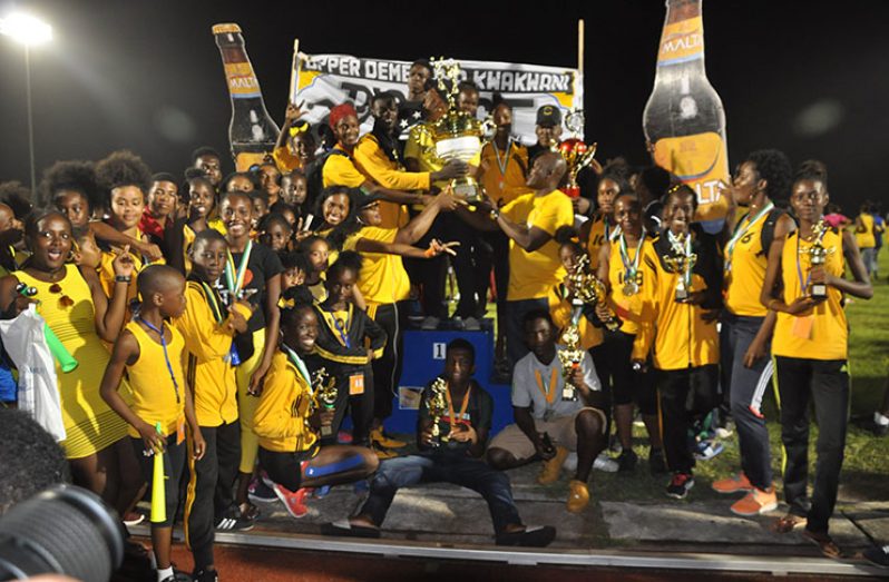 The Upper Demerara/Kwakwani
team is all smiles as they show off their hardware
(Delano Williams photo)