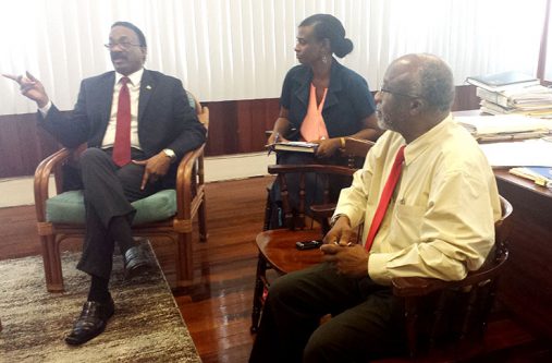 Attorney-General, Basil Williams, left, makes a point during the meeting as Justice Abdullahi Zuru of the Parliamentary Drafting Division of the Attorney-General’s Chambers and an official of the Ministry of Legal Affairs look on