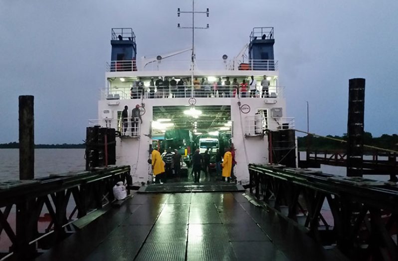 Workers trying to fix the faulty door of the MV Kanawan on Wednesday
