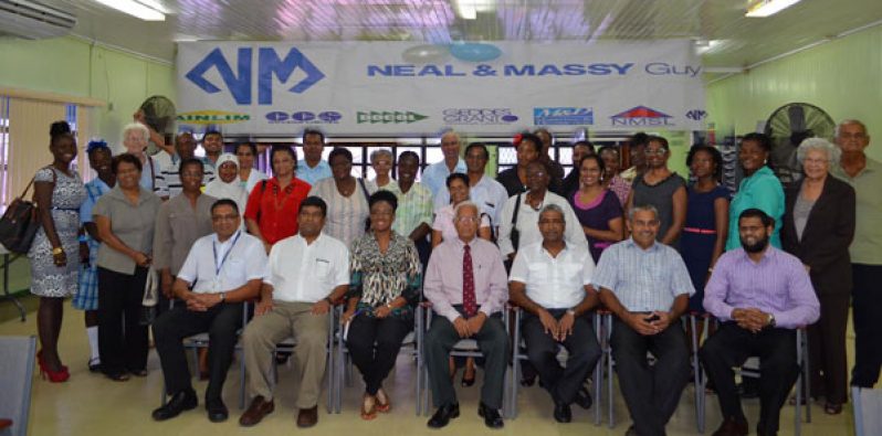 Representatives of the 23 organisations pose with Directors of Neal & Massy Group at the presentation ceremony