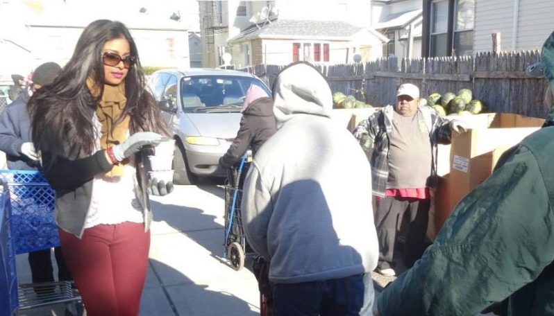 Miss Guyana Universe/Miss New GPC/Limacol hands out food items to those seeking service and love