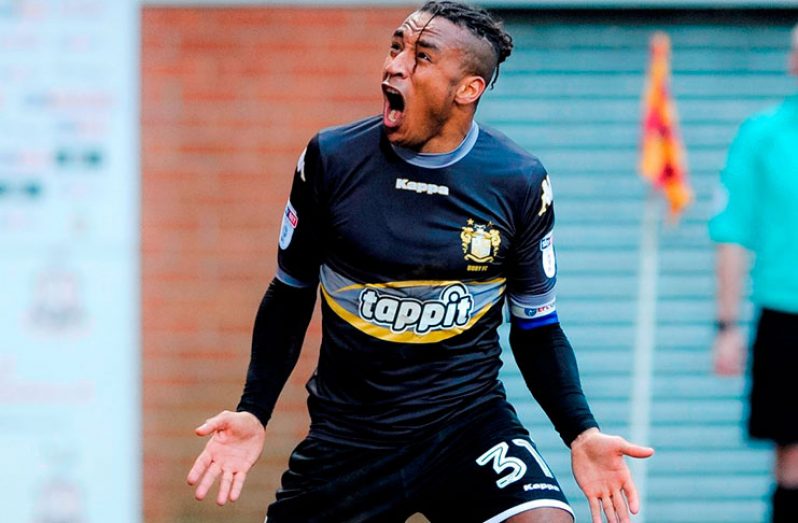 Guyana’s Neil Danns celebrates after scoring for recently promoted League One side Bury FC.