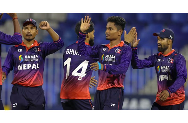 Nepal players celebrate the fall of another West Indies wicket