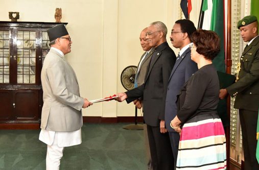 Newly accredited Ambassador of the Federal Democratic Republic of Nepal to Guyana, Dr. Arjun Kumar Karki presenting his Letters of Credence to President David Granger at the simple ceremony at State House on Wednesday