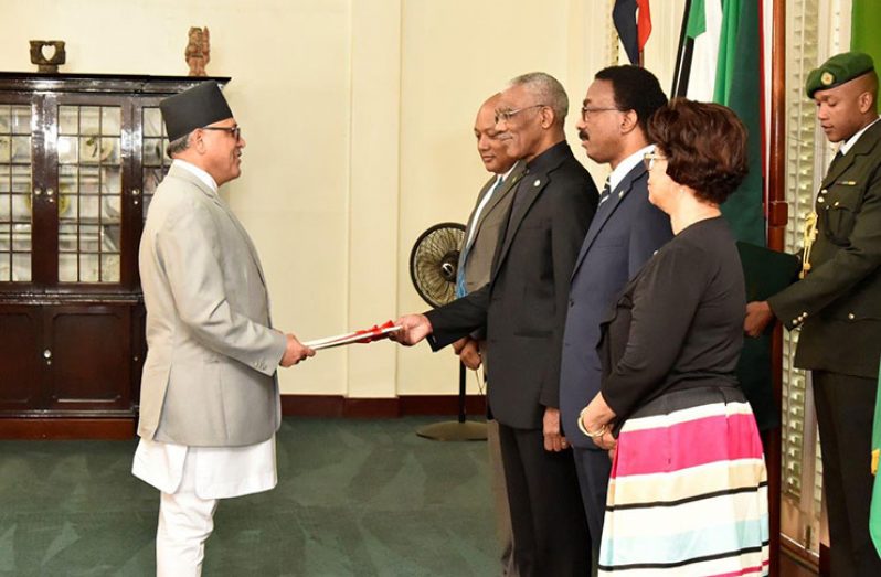 Newly accredited Ambassador of the Federal Democratic Republic of Nepal to Guyana, Dr. Arjun Kumar Karki presenting his Letters of Credence to President David Granger at the simple ceremony at State House on Wednesday