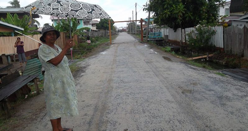 Jaswah Ramlall stands on the newly constructed Third Street in No.64 Village, Berbice, Region 6 