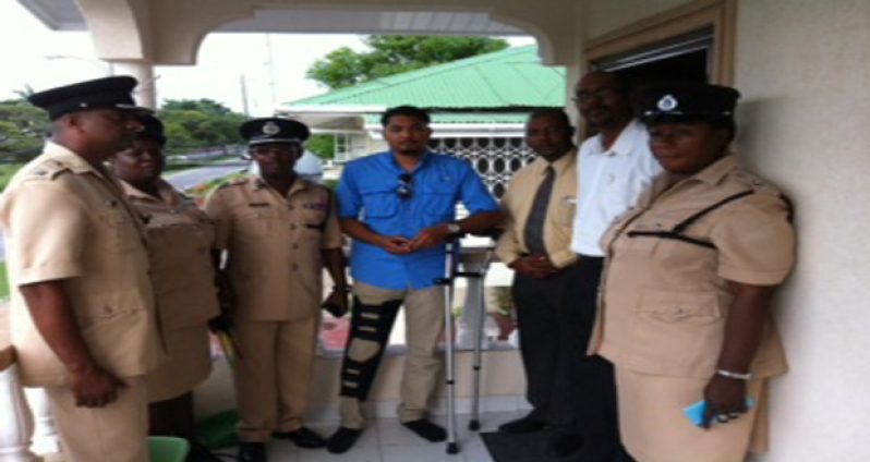 Commander of ‘A’ Division, Assistant Commissioner Clifton Hicken, along with other senior officers and pastors David Cole and Shane Mosley with Nicholas Coates at his home at Bel Air Park, Georgetown