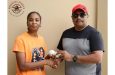 Nidia Andrews receives balls for the tournament from former Berbice all-rounder and businessman Anil Beharry