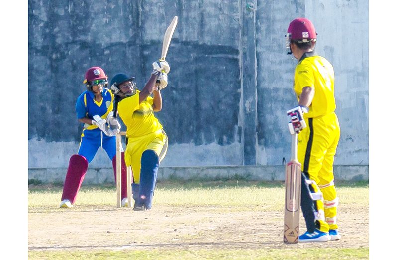 Nikesha Narine hits Nyia Latchman for six during rearguard 31 at Malteenoes yesterday for Essequibo
