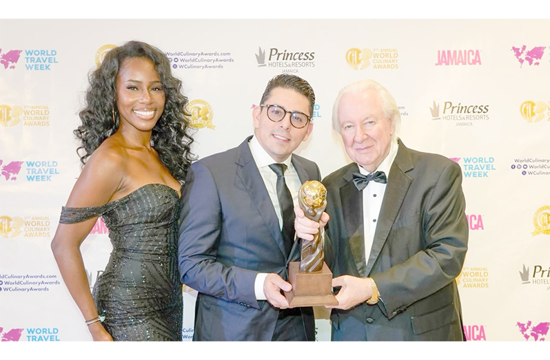 : Executive Chef and Partner of Fusion Hospitality Inc., Victor Tenias Padrón, receives the award from President and Founder of World Culinary Awards, and World Travel Awards, Graham E. Cooke, in Jamaica (Fusion Hospitality Inc. photo)