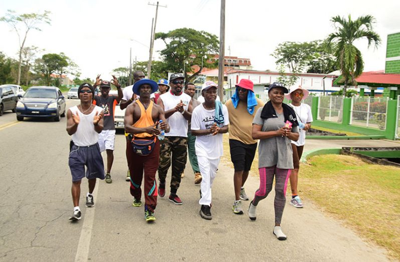 The GBA 100-mile walkathon ended outside of the Cliff Anderson Sports Hall on Sunday. (Adrian Narine photo)